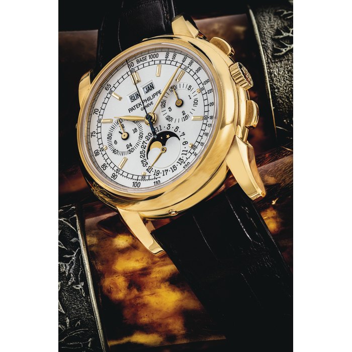 PATEK PHILIPPE. AN 18K GOLD PERPETUAL CALENDAR CHRONOGRAPH WRISTWATCH WITH MOON PHASES, 24 HOUR AND LEAP YEAR INDICATION SIGNED PATEK PHILIPPE, GENEVE, REF. 5970, MOVEMENT NO. 3'049'348, CASE NO. 4'451'786, CIRCA 2008