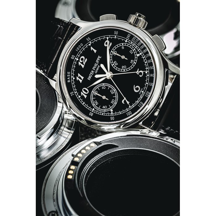 PATEK PHILIPPE. A VERY RARE PLATINUM SPLIT SECONDS CHRONOGRAPH WRISTWATCH WITH BLACK ENAMEL DIAL AND BREGUET NUMERALS SIGNED PATEK PHILIPPE, GENEVE, REF. 5370, MOVEMENT NO. 5'253'929, CASE NO. 6'190'927, CIRCA 2018