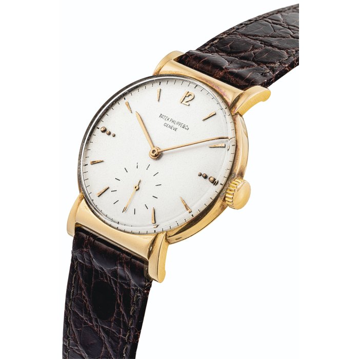 PATEK PHILIPPE. A VERY RARE AND UNUSUAL 18K PINK GOLD WRISTWATCH WITH HALF HOODED LUGS SIGNED PATEK PHILIPPE & CO, GENEVE, REF. 1584, MOVEMENT NO. 926’788, CASE NO. 637’159, MANUFACTURED IN 1945