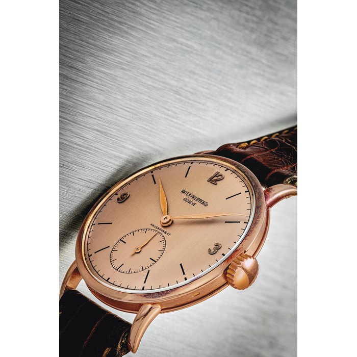 PATEK PHILIPPE. A RARE 18K PINK GOLD WRISTWATCH SIGNED PATEK PHILIPPE & CO, GENEVE, RETAILED BY HAUSMANN & CO, REF. 1513, MOVEMENT NO. 960’715, CASE NO. 644’719, MANUFACTURED IN 1947