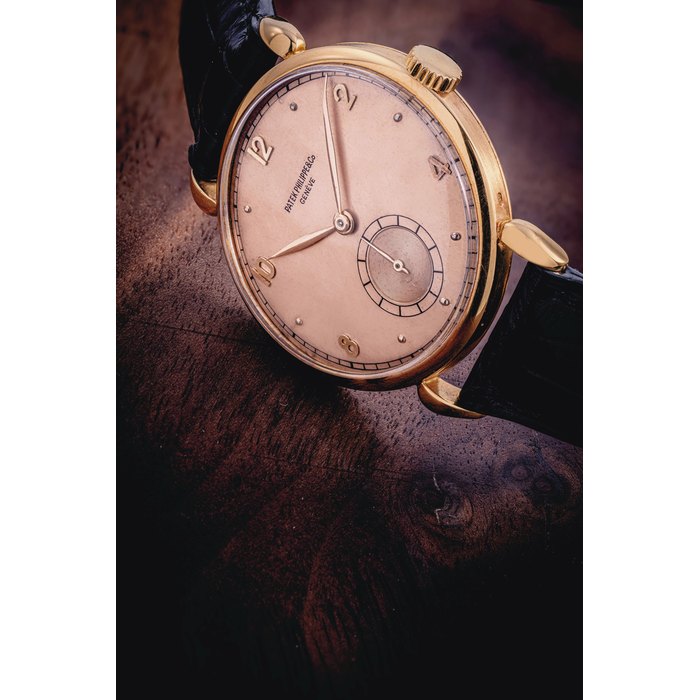 PATEK PHILIPPE. AN 18K PINK GOLD WRISTWATCH WITH "DROP" LUGS SIGNED PATEK PHILIPPE & CO., GENEVE, REF. 1509, MOVEMENT NO. 966'512, CASE NO. 658'332, MANUFACTURED IN 1950