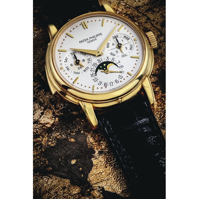 PATEK PHILIPPE. A VERY RARE 18K GOLD AUTOMATIC MINUTE REPEATING PERPETUAL CALENDAR WRISTWATCH WITH MOON PHASES, 24 HOUR, LEAP YEAR AND DAY/NIGHT INDICATION SIGNED PATEK PHILIPPE, GENEVE, REF. 3974, MOVEMENT NO. 1'906'032, CASE NO. 2'867'129, MANUFACTURED IN 1991