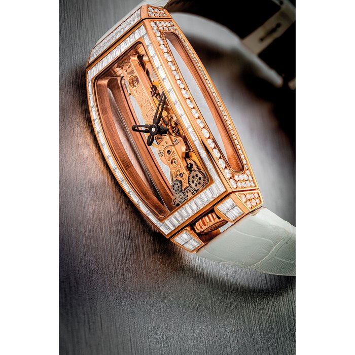 CORUM. A LADY ’ S 18K PINK GOLD AND DIAMOND-SET SKELETONISED WRISTWATCH GOLDEN BRIDGE MODEL, CIRCA 2010