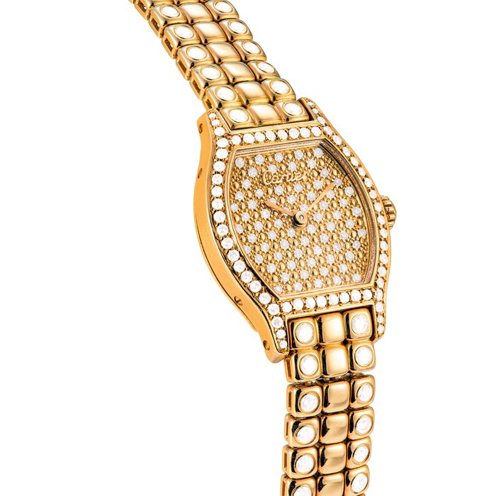 CARTIER. A LADY ’ S 18K GOLD AND DIAMOND-SET TONNEAU SHAPED BRACELET WATCH TORTUE MODEL, CIRCA 1990