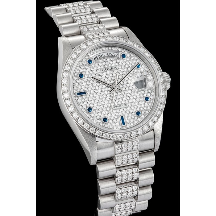 ROLEX. A PLATINUM, SAPPHIRE AND DIAMOND-SET WRISTWATCH WITH SWEEP CENTRE SECONDS, DAY, DATE AND BRACELET DAY-DATE MODEL, REF. 18346, CIRCA 1996