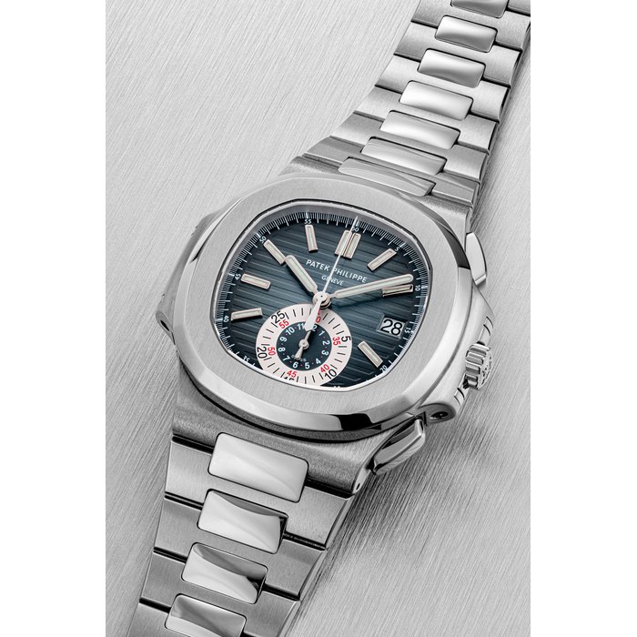 PATEK PHILIPPE. A STAINLESS STEEL AUTOMATIC CHRONOGRAPH WRISTWATCH WITH DATE AND BRACELET NAUTILUS MODEL, REF. 5980, CIRCA 2009