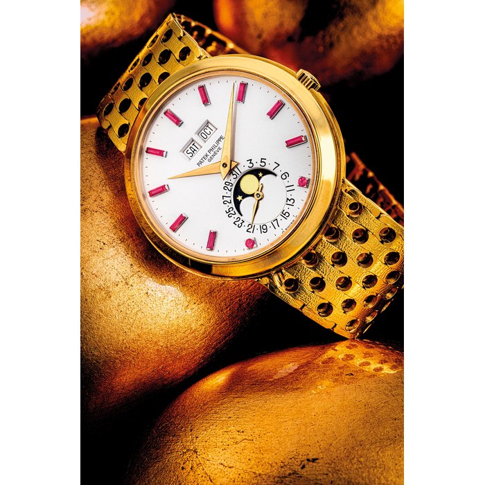 PATEK PHILIPPE. A HIGHLY ATTRACTIVE AND POSSIBLY UNIQUE 18K GOLD AUTOMATIC PERPETUAL CALENDAR WRISTWATCH WITH MOON PHASES, RUBY-SET NUMERALS AND BRACELET REF. 3448/8, MANUFACTURED IN 1965