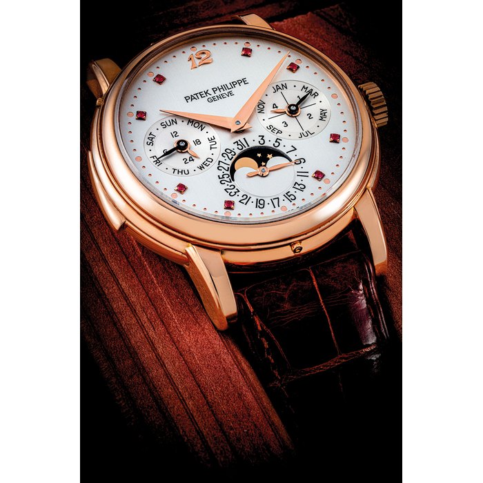 PATEK PHILIPPE. AN IMPORTANT AND POSSIBLY UNIQUE 18K PINK GOLD AUTOMATIC MINUTE REPEATING PERPETUAL CALENDAR WRISTWATCH WITH MOON PHASES, 24 HOUR AND LEAP YEAR INDICATION AND RUBY-SET DIAL REF. 3974, MANUFACTURED IN 1992
