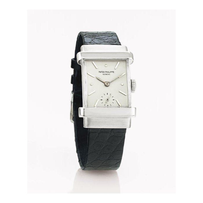 PATEK PHILIPPE. A FINE AND RARE PLATINUM RECTANGULAR WRISTWATCH WITH HOODED LUGS SIGNED PATEK PHILIPPE, GENEVE, "TOP HAT", MOVEMENT NO. 839411, CASE NO. 648442, REF. 1450, MANUFACTURED IN 1947