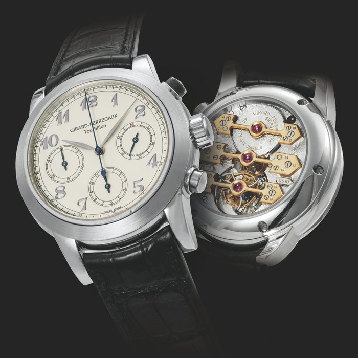 GIRARD-PERREGAUX. A RARE PLATINUM TOURBILLON CHRONOGRAPH WRISTWATCH WITH THREE GOLD BRIDGES CIRCA 2010