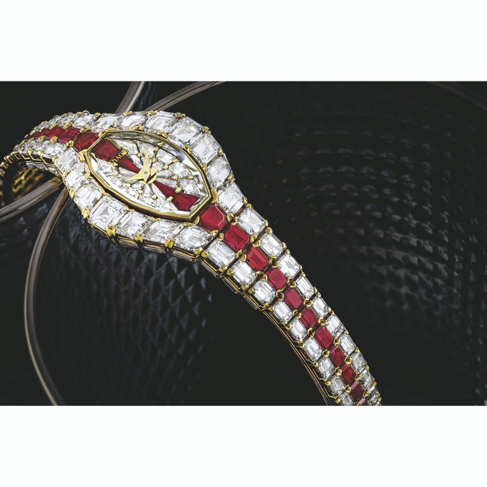 PIAGET. AN IMPRESSIVE 18K GOLD, DIAMOND AND RUBY-SET BRACELET WATCH AURA MODEL, MANUFACTURED IN 1989