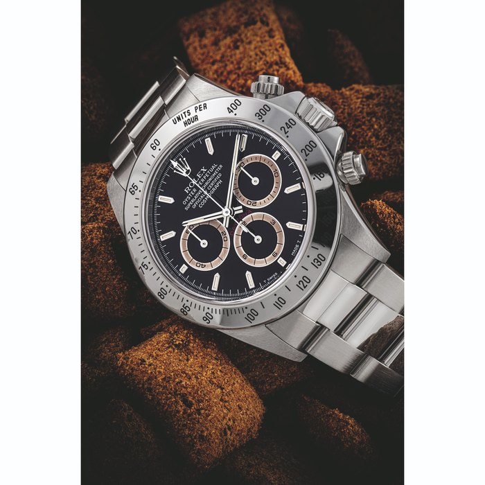 Rolex ROLEX. A N ATTRACTIVE STAINLESS STEEL AUTOMATIC CHRONOGRAPH WRISTWATCH WITH BRACELET AND TROPICAL REGISTER S DAYTONA MODEL, REF. 16520, CIRCA 1997, Price & Market Data