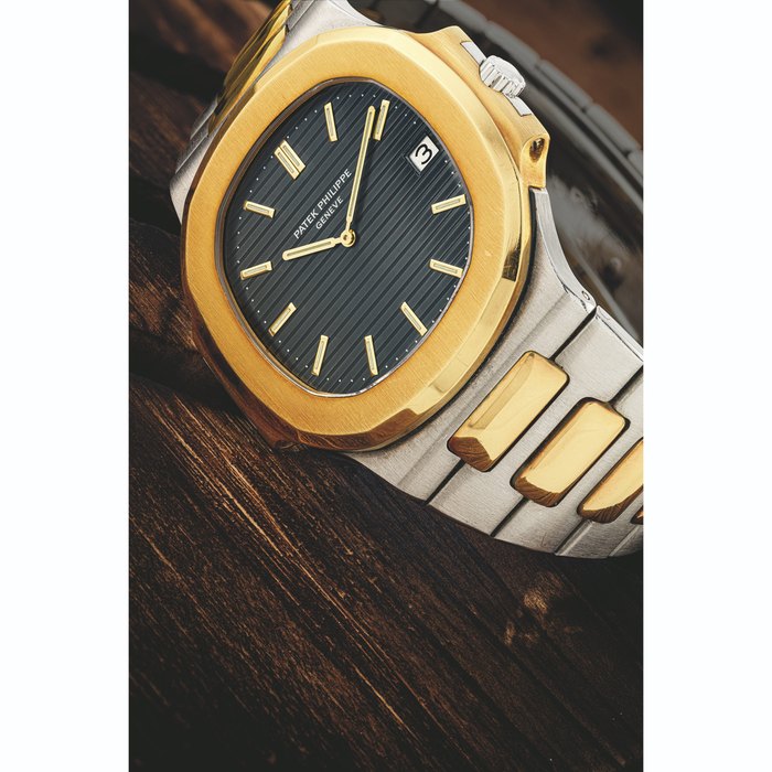PATEK PHILIPPE. AN 18K GOLD AND STAINLESS STEEL AUTOMATIC WRISTWATCH WITH DATE AND BRACELET NAUTILUS MODEL, REF. 3700/1, MANUFACTURED IN 1981