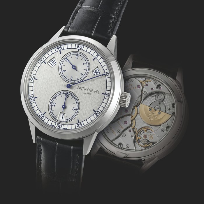 PATEK PHILIPPE. AN 18K WHITE GOLD AUTOMATIC ANNUAL CALENDAR WRISTWATCH WITH REGULATOR-STYLE DIAL REF. 5235, MANUFACTURED IN 2014