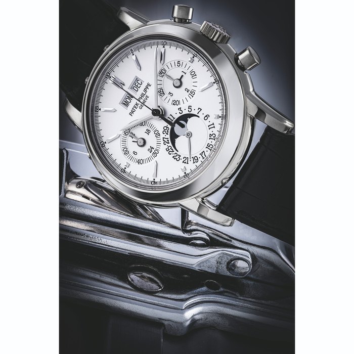 PATEK PHILIPPE. AN 18K WHITE GOLD PERPETUAL CALENDAR CHRONOGRAPH WRISTWATCH WITH MOON PHASES, 24 HOUR AND LEAP YEAR INDICATION REF. 3970E, MANUFACTURED IN 2004