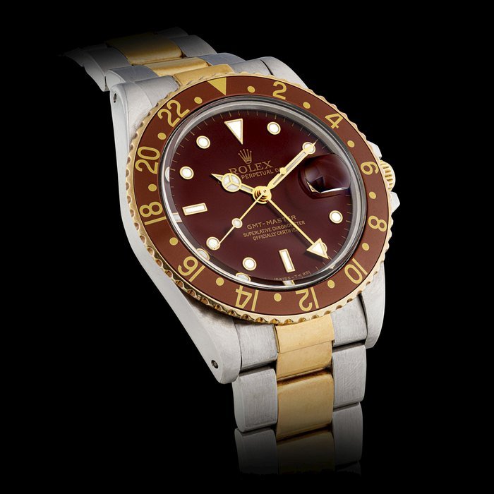 Rolex ROLEX. A STAINLESS STEEL AND 18K GOLD AUTOMATIC DUAL TIME WRISTWATCH WITH SWEEP CENTRE SECONDS, DATE AND BRACELET GMT-MASTER MODEL, REF. 16753, CIRCA 1982 · 16753