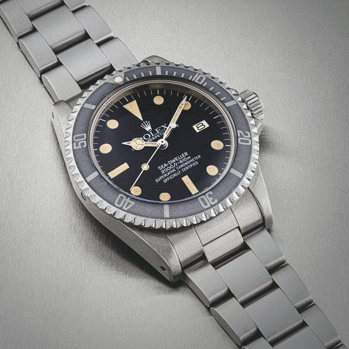ROLEX. A STAINLESS STEEL AUTOMATIC WRISTWATCH WITH SWEEP CENTRE SECONDS, DATE AND BRACELET SEA-DWELLER MODEL, REF. 1665, CIRCA 1979