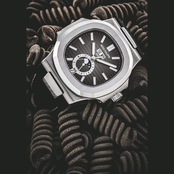 PATEK PHILIPPE. A STAINLESS STEEL ANNUAL CALENDAR AUTOMATIC WRISTWATCH WITH SWEEP CENTRE SECONDS, MOON PHASES AND 24-HOUR INDICATION REF. 5726A, CIRCA 2012