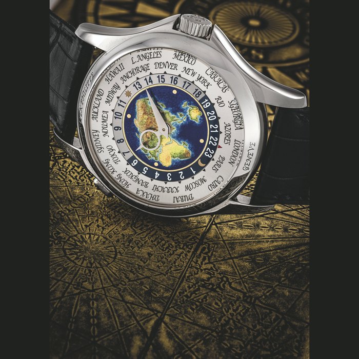 PATEK PHILIPPE. A FINE 18K WHITE GOLD WORLD TIME AUTOMATIC WRISTWATCH WITH CLOISONNÉ ENAMEL DIAL REF.5131G-001, CIRCA 2011