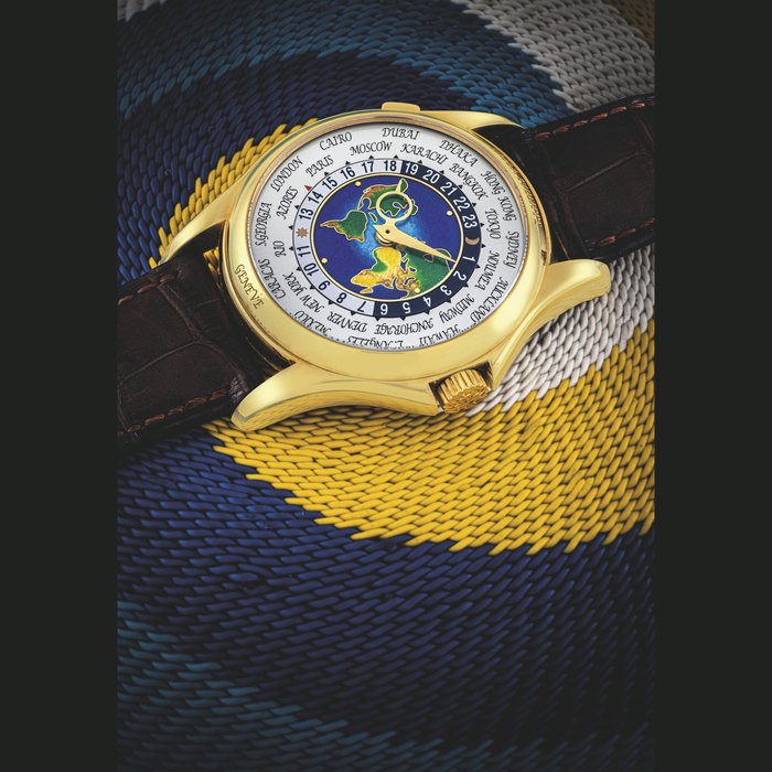 PATEK PHILIPPE. A RARE 18K GOLD AUTOMATIC WORLD TIME WRISTWATCH WITH CLOISONNÉ ENAMEL DIAL REF. 5131, CIRCA 2014