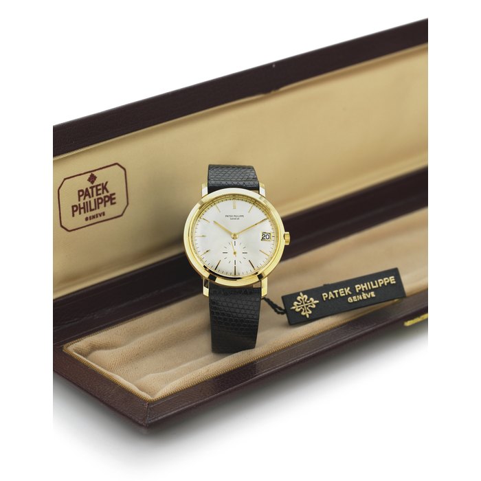 PATEK PHILIPPE. AN EXTREMELY FINE AND RARE 18K GOLD AUTOMATIC WATER-RESISTANT WRISTWATCH WITH DATE SIGNED PATEK PHILIPPE, GENEVE, MOVEMENT NO. 1232782, CASE NO. 2784404, REF. 3445/100, MOVEMENT MANUFACTURED IN 1974 AND ENCASED IN 1984