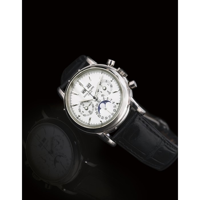 PATEK PHILIPPE. A RARE 18K WHITE GOLD PERPETUAL CALENDAR CHRONOGRAPH WRISTWATCH WITH MOON PHASES SIGNED PATEK PHILIPPE, GENEVE, MOVEMENT NO. 3045986, CASE NO. 4072854, REF. 3970E, MANUFACTURED IN 1999