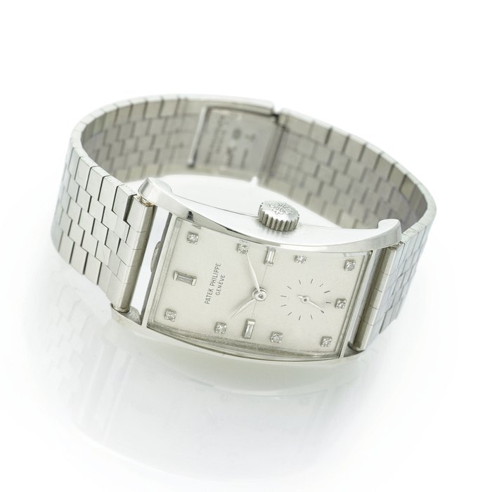 PATEK PHILIPPE. A RARE PLATINUM AND DIAMOND RECTANGULAR WRISTWATCH WITH BRACELET SIGNED PATEK PHILIPPE, MOVEMENT NO. 977243, CASE NO. 2602961, REF. 1593, MANUFACTURED IN 1958