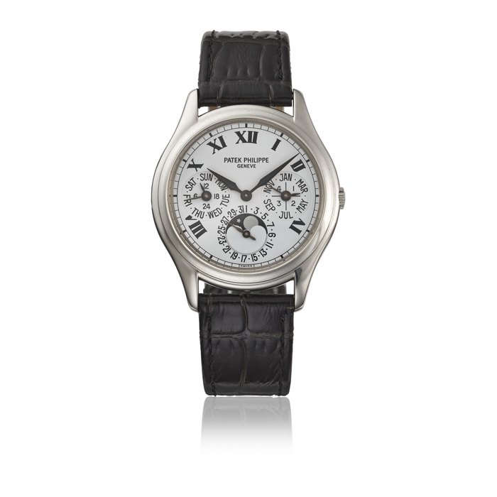 PATEK PHILIPPE. AN EXTREMELY RARE PLATINUM AUTOMATIC PERPETUAL CALENDAR WRISTWATCH WITH MOON PHASES, 24 HOUR, LEAP YEAR INDICATION, CERTIFICATE OF ORIGIN AND BOX SIGNED PATEK PHILIPPE, GENEVE, REF. 3940, CIRCA 2002
