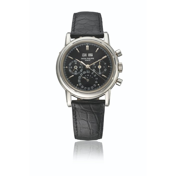 PATEK PHILIPPE. A VERY RARE PLATINUM PERPETUAL CALENDAR CHRONOGRAPH WRISTWATCH WITH MOON PHASES, 24 HOUR INDICATION, LEAP YEAR INDICATION AND BLACK DIAL SIGNED PATEK PHILIPPE, GENEVE, REF. 3970E, MOVEMENT NO. 3'045'727, CASE NO. 4'025'570, MANUFACTURED IN 1997