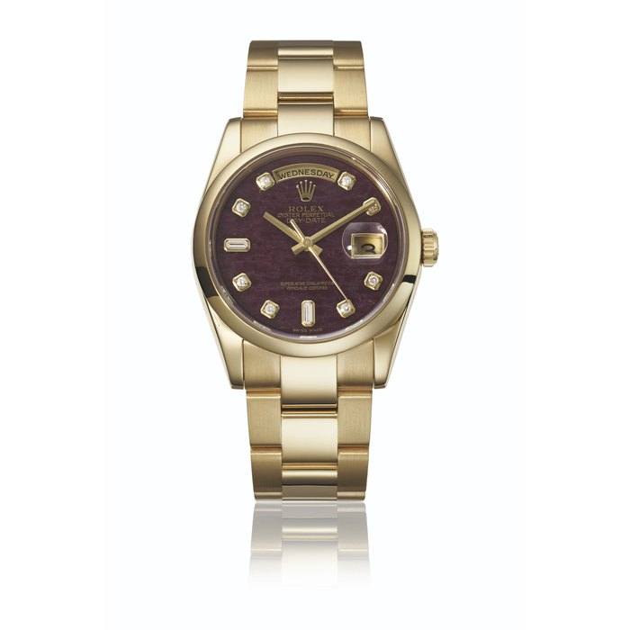 ROLEX. AN EXTREMELY ATTRACTIVE 18K GOLD AND DIAMOND-SET AUTOMATIC WRISTWATCH WITH SWEEP CENTRE SECONDS, DAY, DATE, BRACELET AND GROSSULAR GARNET RUBELLITE DIAL SIGNED ROLEX, DAY-DATE MODEL, REF. 118208, CASE NO. Y135115, CIRCA 2002
