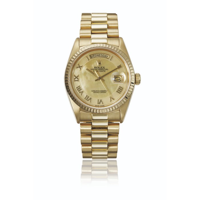 ROLEX. A RARE 18K GOLD AUTOMATIC WRISTWATCH WITH SWEEP CENTRE SECONDS, DAY, DATE, BRACELET AND MOTHER-OF PEARL DIAL SIGNED ROLEX, DAY-DATE MODEL, REF. 18038, CASE NO. 9'380'643, CIRCA 1986