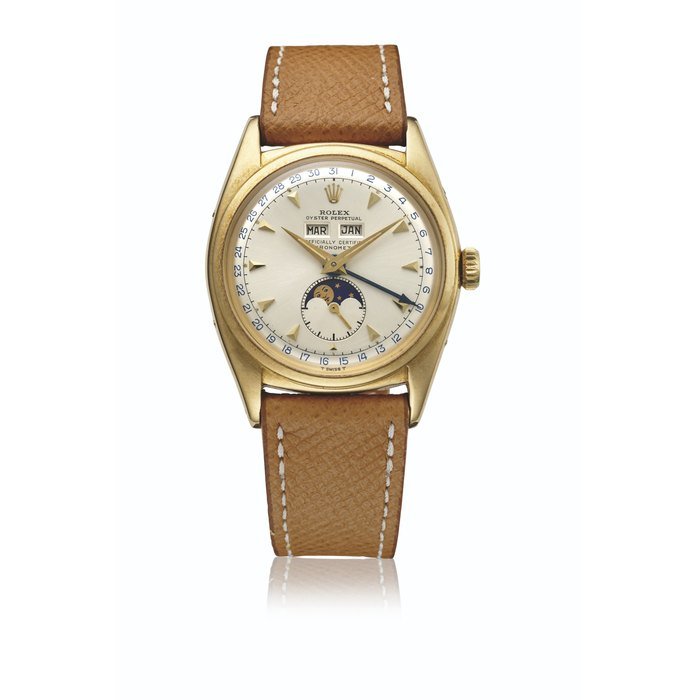 Rolex ROLEX. AN EXTREMELY RARE 18K GOLD AUTOMATIC TRIPLE CALENDAR WRISTWATCH WITH MOON PHASES AND SERVICE DIAL SIGNED ROLEX, OYSTER PERPETUAL, OFFICIALLY CERTIFIED CHRONOMETER, REF. 6062, CASE NO. 911'150, MOVEMENT NOS.00176, N32850, CIRCA 1953 · 6062