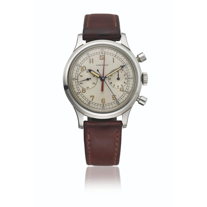 LONGINES. A VERY RARE AND ATTRACTIVE STAINLESS STEEL CHRONOGRAPH WRISTWATCH WITH RED-COLORED CENTER ELAPSED MINUTE COUNTER SIGNED LONGINES, DOPPIA LANCETTA MODEL, REF. 5699, ORDER NO. 23086, MOVEMENT NO. 6'940'707, CASE NO. 235, CIRCA 1947