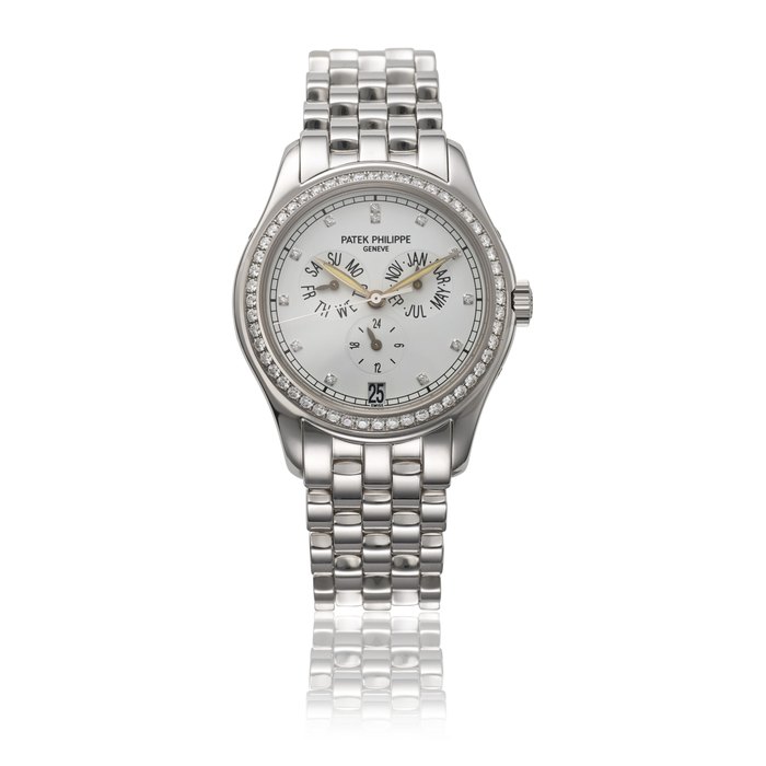 PATEK PHILIPPE. AN 18K WHITE GOLD AND DIAMOND-SET AUTOMATIC ANNUAL CALENDAR WRISTWATCH WITH SWEEP CENTRE SECONDS, DATE, DAY AND NIGHT INDICATION, BRACELET, CERTIFICATE OF ORIGIN AND BOX SIGNED PATEK PHILIPPE GENEVE, REF. 5037, CIRCA 2002