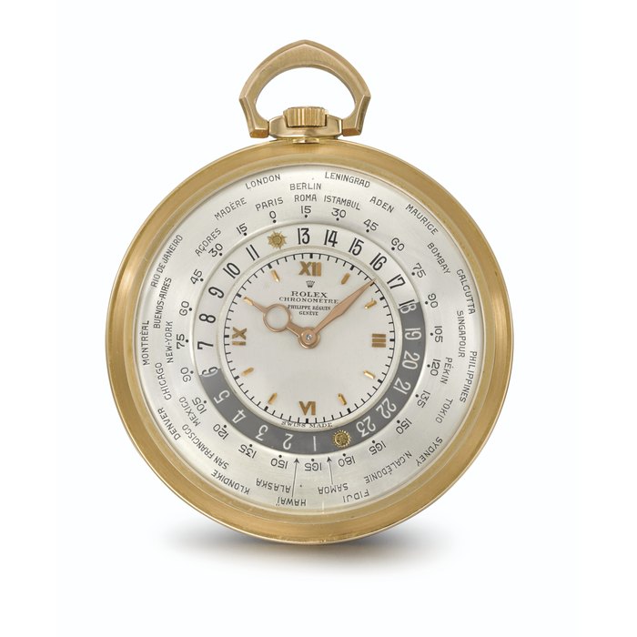 ROLEX. AN EXTREMELY FINE AND EXCEPTIONALLY RARE 18K GOLD OPENFACE KEYLESS LEVER WORLD TIME WATCH SIGNED ROLEX, CHRONOMETRE, RETAILED BY PHILIPPE BEGUIN, GENEVE, REF. 4262, MOVEMENT NO. 1'001'207, CASE NO. 1'010'381, CIRCA 1945