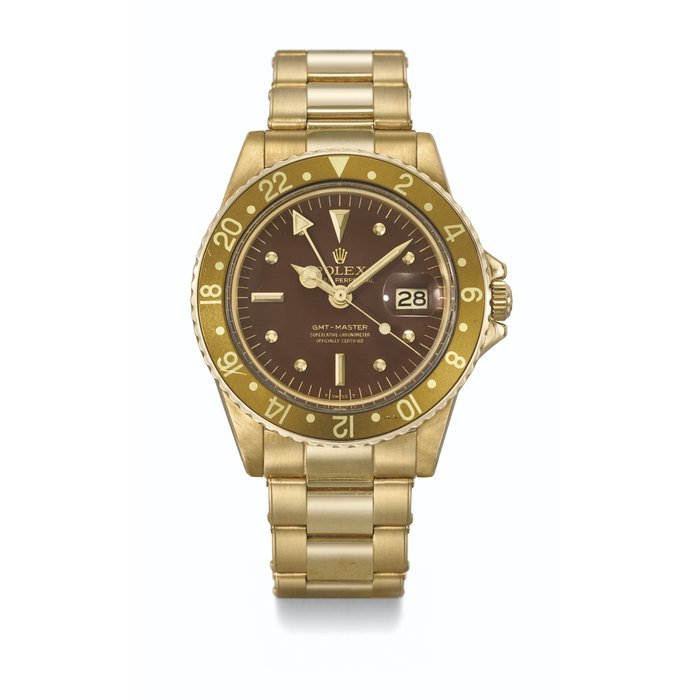 Rolex ROLEX. AN ATTRACTIVE 18K GOLD AUTOMATIC DUAL TIME WRISTWATCH WITH SWEEP CENTRE SECONDS, DATE AND BRACELET SIGNED ROLEX, GMT MASTER MODEL, REF. 1675, CASE NO. 2'869'899, CIRCA 1971 · 1675