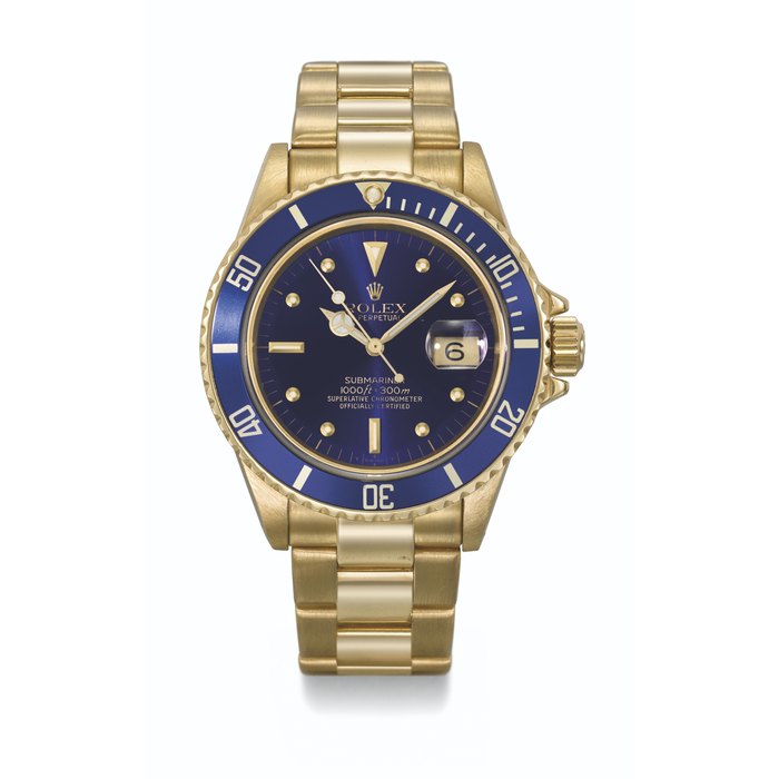 ROLEX. AN ATTRACTIVE 18K GOLD AUTOMATIC WRISTWATCH WITH SWEEP CENTRE SECONDS, DATE AND BRACELET SIGNED ROLEX, SUBMARINER MODEL, REF. 16808, CASE NO. R743005, CIRCA 1988
