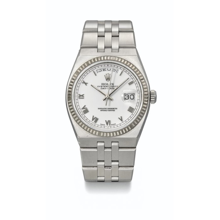ROLEX. AN EXTREMELY RARE AND IMPORTANT STAINLESS STEEL PERPETUAL CALENDAR WRISTWATCH WITH BRACELET SIGNED ROLEX, OYSTERQUARTZ DAY-DATE MODEL, PROTOTYPE, CIRCA 2000