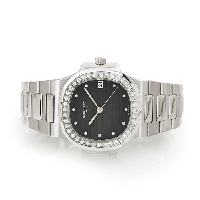PATEK PHILIPPE. A FINE 18K WHITE GOLD AND DIAMOND AUTOMATIC WRISTWATCH WITH CENTER SECONDS, DATE AND BRACELET SIGNED PATEK PHILIPPE, GENEVE, NAUTILUS ,, MOVEMENT NO. 1932056, CASE NO. 2905612, REF. 3800/3, MANUFACTURED IN 1994