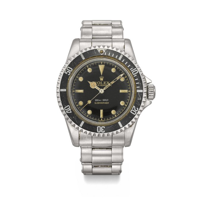 ROLEX. A RARE AND HIGHLY ATTRACTIVE STAINLESS STEEL AUTOMATIC WRISTWATCH WITH SWEEP CENTRE SECONDS, POINTED CROWN GUARD, BRACELET AND GILT GLOSSY DIAL SIGNED ROLEX, SUBMARINER MODEL, REF. 5512, CASE NO. 'HARDLY VISIBLE', CIRCA 1960