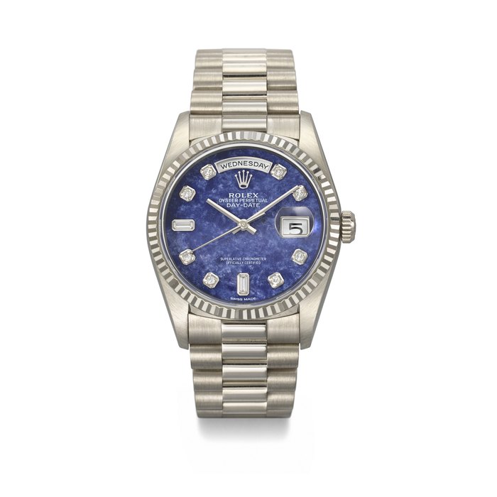 ROLEX. A RARE AND HIGHLY ATTRACTIVE 18K WHITE GOLD AND DIAMOND-SET AUTOMATIC WRISTWATCH WITH SWEEP CENTRE SECONDS, BRACELET AND SODALITE DIAL SIGNED ROLEX, DAY-DATE MODEL, REF. 18239, CASE NO. A592190, CIRCA 1999