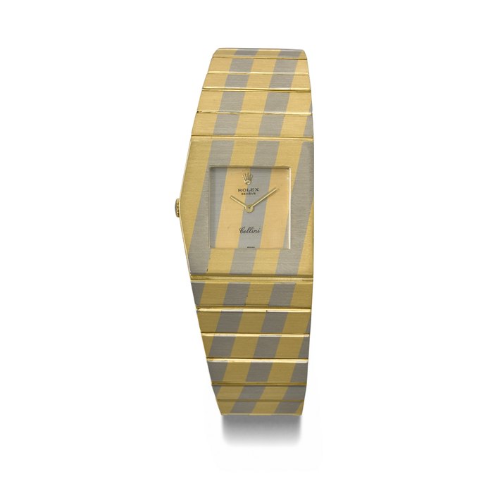 ROLEX. AN EXTREMELY RARE STRIPED 18K TWO COLOUR GOLD ASYMMETRIC LEFT-HAND WINDING WRISTWATCH WITH INTEGRAL 18K TWO COLOUR GOLD ROLEX ‘ KING MIDAS ’ BRACELET AND ORIGINAL VASE-FORM BOX SIGNED ROLEX, CELLINI, KING MIDAS MODEL, REF. 4915, NO. 5744, CASE NO. 4’369’004 /155 122 050, CIRCA 1977