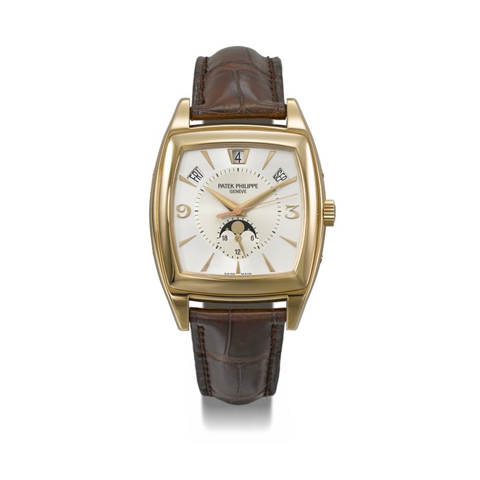 PATEK PHILIPPE. AN ELEGANT 18K PINK GOLD TONNEAU-SHAPED AUTOMATIC ANNUAL CALENDAR WRISTWATCH WITH SWEEP CENTRE SECONDS, MOON PHASES, 24-HOUR INDICATION, CERTIFICATE OF ORIGIN AND BOX SIGNED PATEK PHILIPPE, GENEVE, GONDOLO CALENDARIO MODEL, REF. 5135R-001, MOVEMENT NO. 3'423'343, CASE NO. 4'385'571, CIRCA 2010