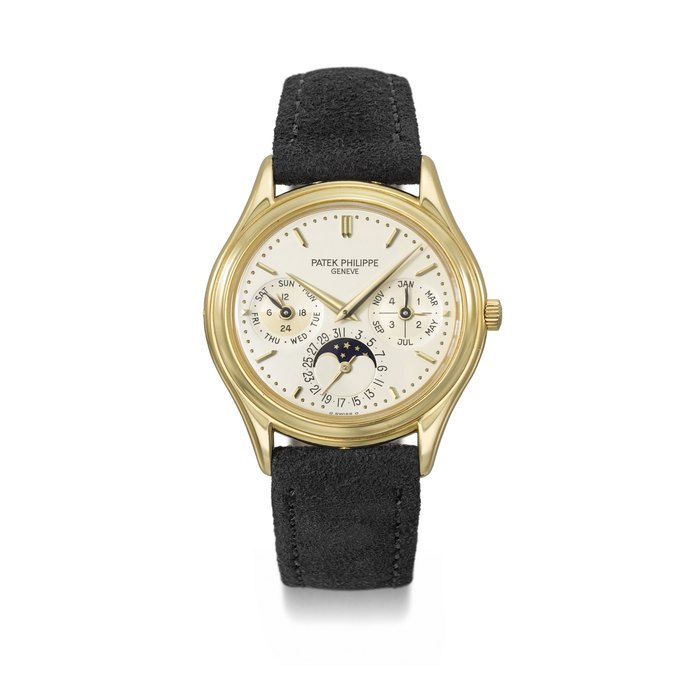 PATEK PHILIPPE. AN ELEGANT 18K GOLD AUTOMATIC PERPETUAL CALENDAR WRISTWATCH WITH MOON PHASES, 24 HOUR AND LEAP YEAR INDICATION, CERTIFICATE OF ORIGIN AND BOX SIGNED PATEK PHILIPPE, GENEVE, REF. 3940, SECOND SERIES, MOVEMENT NO. 772'398, CASE NO. 2'884'663, MANUFACTURED IN 1990
