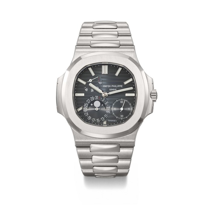 PATEK PHILIPPE. AN EXTREMELY RARE STAINLESS STEEL AUTOMATIC WRISTWATCH WITH DATE, MOON PHASES, POWER RESERVE, BRACELET, CERTIFICATE OF ORIGIN AND BOX SIGNED PATEK PHILIPPE, GENEVE, RETAILED BY TIFFANY & CO., NAUTILUS MODEL, REF. 5712⁄1A-001, MOVEMENT NO. 5'994'676, CASE NO. 6'136'180, CIRCA 2016