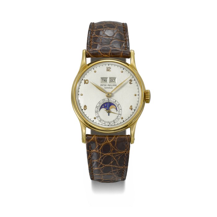 PATEK PHILIPPE. A RARE AND ATTRACTIVE 18K GOLD PERPETUAL CALENDAR WRISTWATCH WITH MOON PHASES SIGNED PATEK PHILIPPE, GENEVE, REF. 1526, MOVEMENT NO. 962’283, CASE NO. 653’852, MANUFACTURED IN 1949