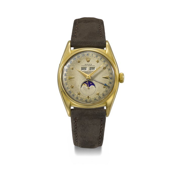 Rolex ROLEX . A VERY RARE 18K GOLD AUTOMATIC TRIPLE CALENDAR WRISTWATCH WITH MOON PHASES AND STAR DIAL SIGNED ROLEX, OYSTER PERPETUAL, OFFICIALLY CERTIFIED CHRONOMETER, REF. 6062, CASE NO. 788’610, CIRCA 1952 · 6062