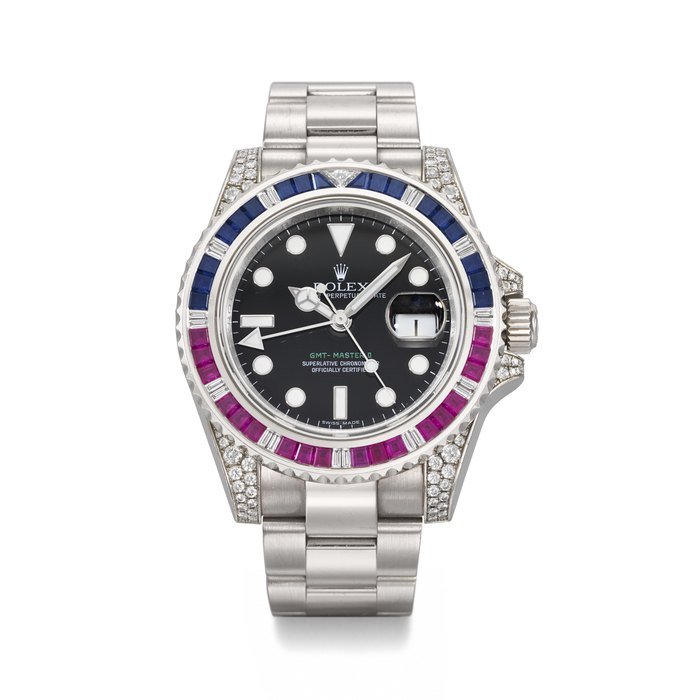 Rolex ROLEX. A RARE AND ATTRACTIVE 18K WHITE GOLD, DIAMOND, RUBY AND SAPPHIRE-SET AUTOMATIC DUAL TIME WRISTWATCH WITH SWEEP CENTRE SECONDS, DATE, BRACELET, GUARANTEE AND BOX SIGNED ROLEX, GMT MASTER 'SARU' MODEL, REF. 116759SARU, CIRCA 2009 · 116759SARU