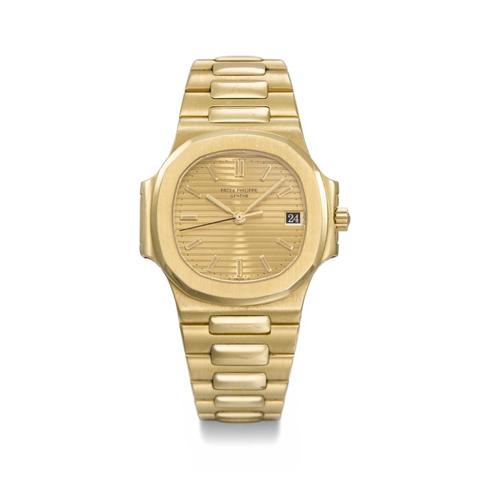 PATEK PHILIPPE. A RARE AND HIGHLY ATTRACTIVE 18K GOLD AUTOMATIC WRISTWATCH WITH SWEEP CENTRE SECONDS, DATE AND BRACELET SIGNED PATEK PHILIPPE, GENEVE, NAUTILUS MODEL, REF. 3800/1, FIRST SERIES, MOVEMENT NO. 1'424'535, CASE NO. 2'819'460, MANUFACTURED IN 1984