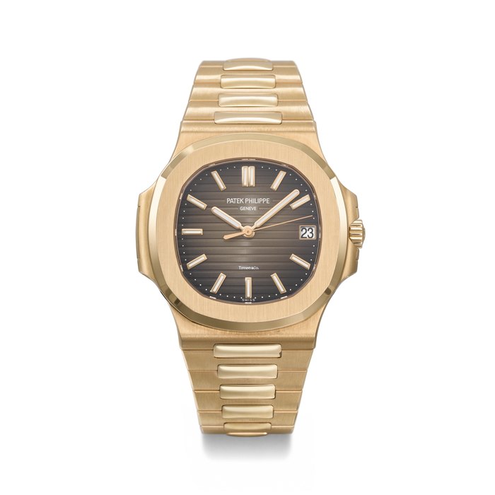 PATEK PHILIPPE. AN EXTREMELY RARE 18K PINK GOLD AUTOMATIC WRISTWATCH WITH SWEEP CENTRE SECONDS, DATE, BRACELET, CERTIFICATE OF ORIGIN AND BOX SIGNED PATEK PHILIPPE, GENEVE, RETAILED BY TIFFANY & CO., NAUTILUS MODEL, REF. 5711/1R-001, CIRCA 2017